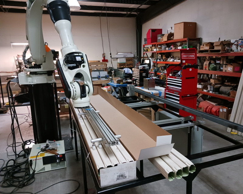 Building a new packaging machine where cartons are unloaded by Kawasaki BX300 robot